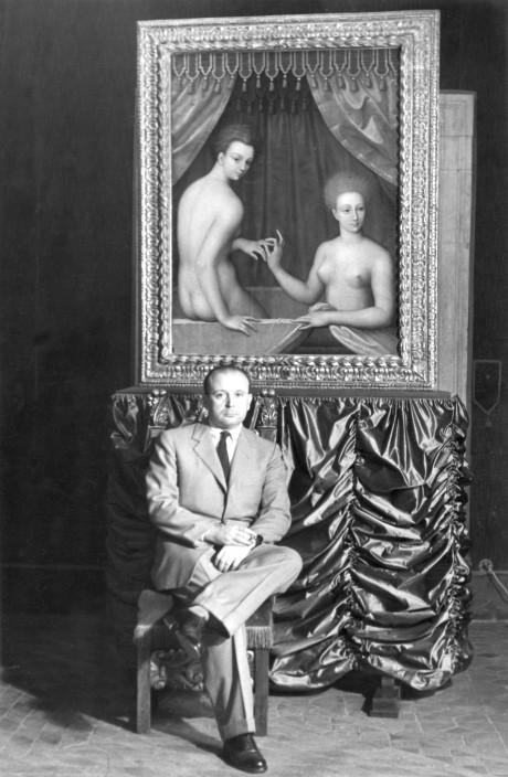 Rodolfo Siviero, art historian and secret agent, posing in front of a restored late-16th-century School of Fontainebleau painting in a room in Palazzo Venezia during the Second National Exhibition of Artwork Returned from Germany, 1951 
