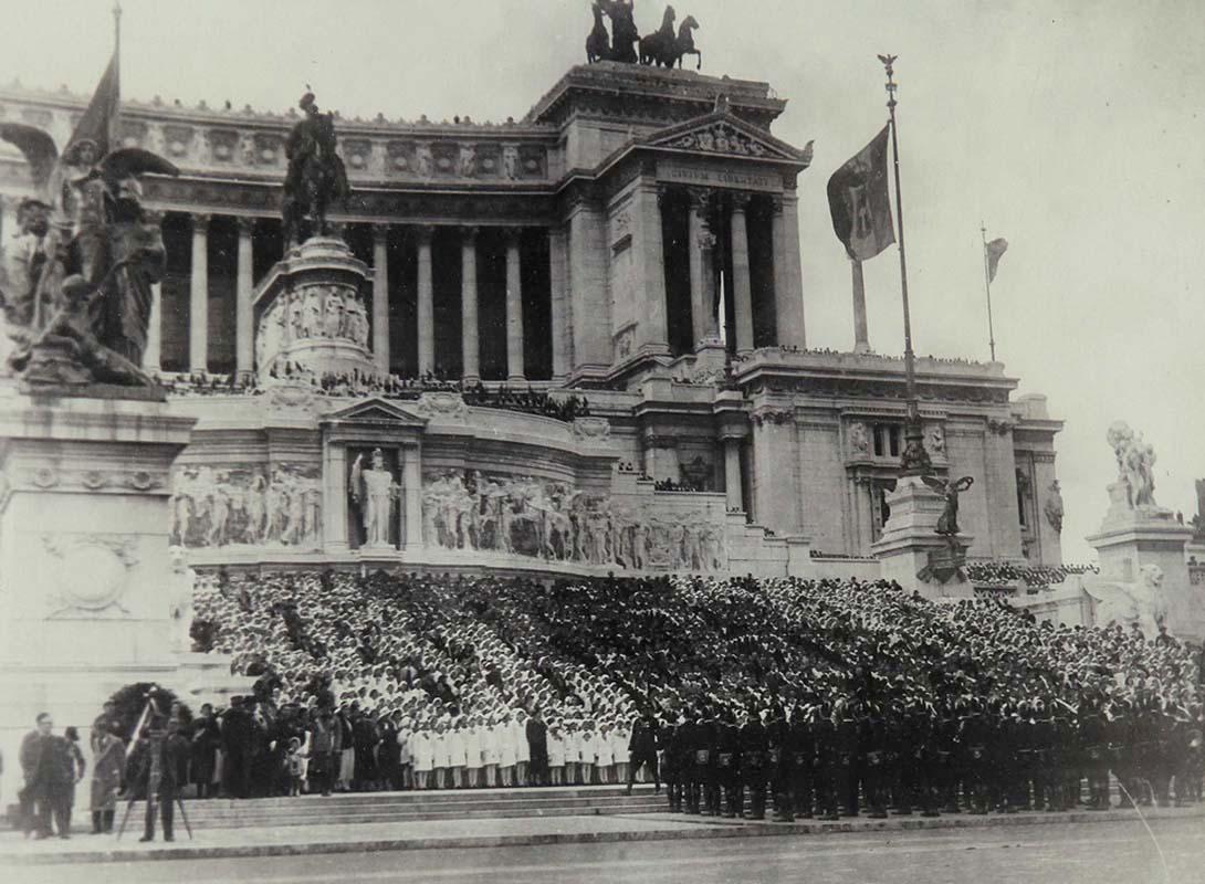 A crowd waits for Mussolini to pass before the Vittoriano during the military parade in Via dell’Impero (now Via dei Fori Imperiali) held to mark the 10th anniversary of Italian Fascism
