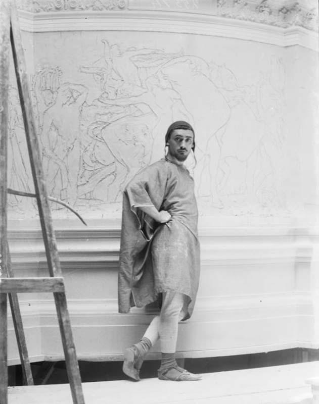 Sculptor Angelo Zanelli in his studio, working on a preparatory model, photographed by Mario Nunes Vais
