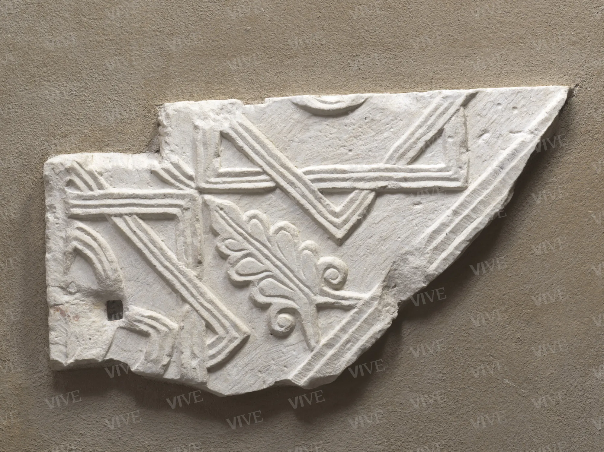 Fragment of pluteus with star-shaped quadrilaterals and sapling - Roman milieu